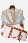 A light-colored blazer on a wooden hanger is stored in The Windbreaker Jacket's beige Smart No-Wrinkle Foldable Travel Bag, which features brown leather accents and handles and is partially unzipped to reveal the interior lining.